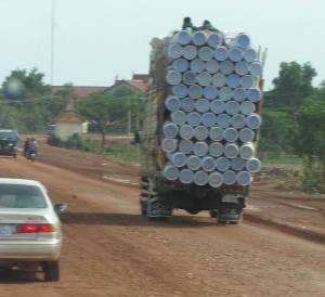 Sitting atop a loaded truck on the highway