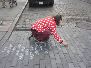 Love-focused, pyjama-wearing street artist on a SoHo street last week