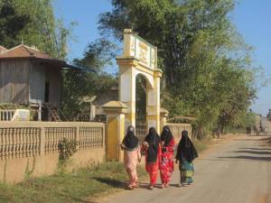 Islamic girls leaving a local Mosque, books in hand and lots of excited "Hellos"