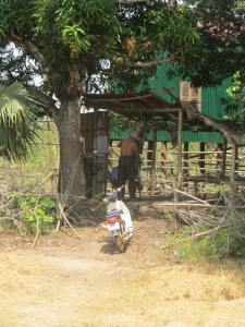 Village barber shops are almost always shacks under trees.  Often the only place where you can find a mirror too!