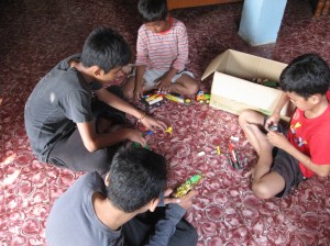 Older boys introduce our new resident boy to the toy situation at Phter Koma today